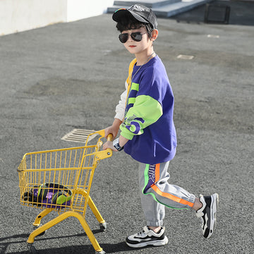 Playground Ready: Modern athletic set with vibrant yellow and green accents. Features durable ribbed cuffs and a secure elastic waistband for all-day play.