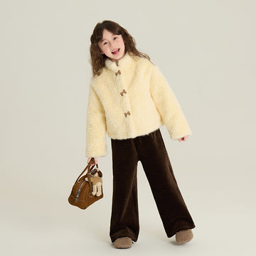 Winter Chic: A cozy cream sherpa jacket featuring a stylish contrast collar and button-down front. Paired with dark trousers for a sophisticated winter look