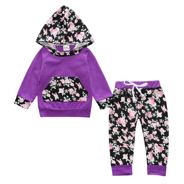 Purple Petals: Bold purple hoodie with an intricate floral pocket and hood lining. The coordinating dark floral pants create a stylish and warm ensemble.