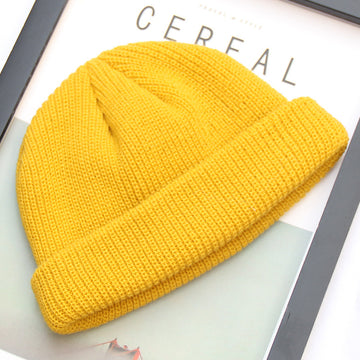 A bright pop of yellow. Chunky knit texture in a trendy, short fisherman style.
