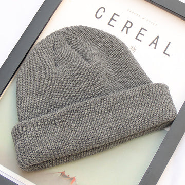 Versatile charcoal grey knit. The perfect neutral accessory for a clean, modern look.