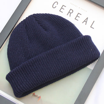 Timeless dark blue knit. Essential minimalist headwear with a comfortable, stretchy fit.