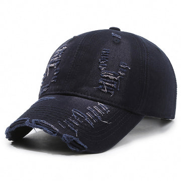 Dark blue denim-style wash. Features a pre-curved brim and premium torn-fabric detailing.