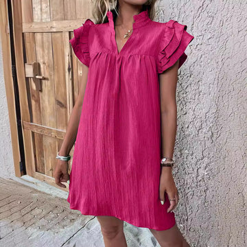 Hot Pink: Make a statement in this vibrant fuchsia mini. Features a loose, comfortable fit and feminine flutter sleeve details.