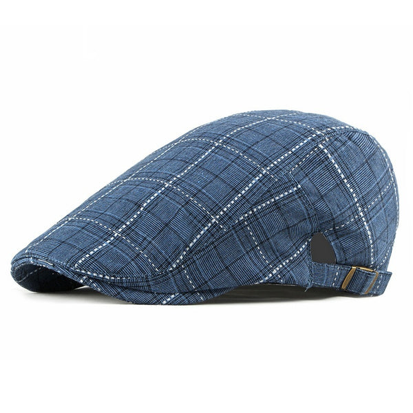 Classic navy plaid with a modern flat cap silhouette. Sophisticated and stylish.
