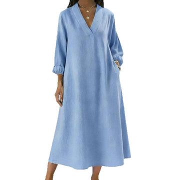 Cornflower Blue: A calming, bright blue shade. Effortlessly chic with a relaxed drape and elegant long sleeves.