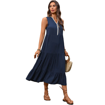 Modern Classic: Versatile sleeveless navy maxi. Combines a modest neckline with a modern, flared floor-length hem.