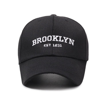 Bold "Brooklyn" text on a sharp black crown. Timeless streetwear aesthetic.