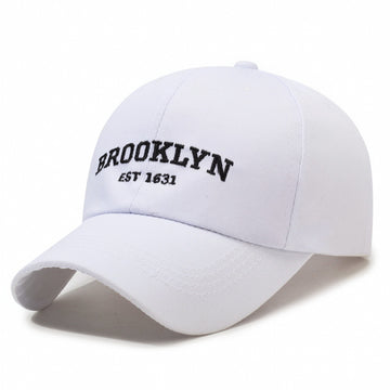 Crisp white cap with high-contrast black embroidery. Fresh, clean, and iconic