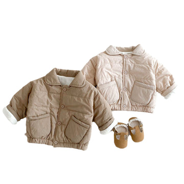 Modern Quilt: A high-quality bomber-style coat with deep textured quilting. Designed for maximum comfort and full range of motion for active toddlers.
