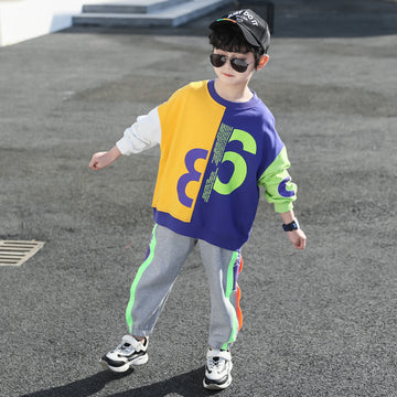 Graphic Style: Eye-catching oversized "85" print on a multi-color paneled top. A trendy, high-energy outfit that combines comfort with a cool aesthetic.