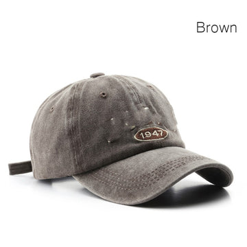 Classic coffee-toned wash. Premium embroidered details on a sturdy, adjustable strap-back.