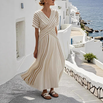 Resort Ready: Flowy, floor-length silhouette with a soft wrap tie. A must-have for beachside dinners.