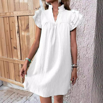 Pure White: Crisp and ethereal. This lightweight white V-neck dress is the perfect choice for beach days or summer brunches.